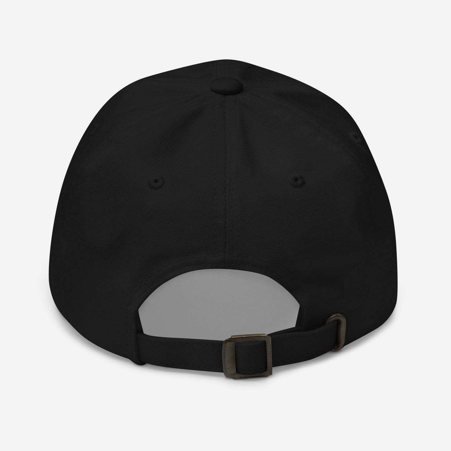 Black cap with antique buckle on back against a white back ground.