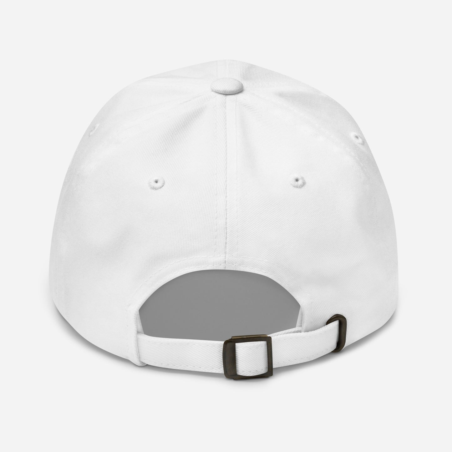 White baseball cap with antique buckle on back against a white back ground.